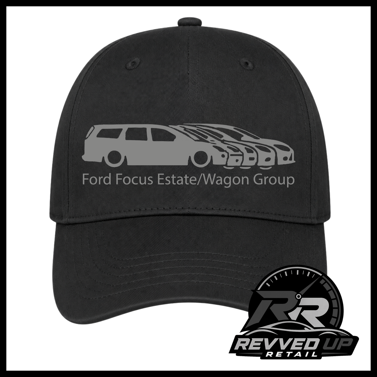 A black baseball cap featuring a grey  graphic of a Ford Focus estate and wagon group with the text 'Ford Focus Estate/Wagon Group' on the front. A Revved Up Retail logo is visible in the bottom right corner.