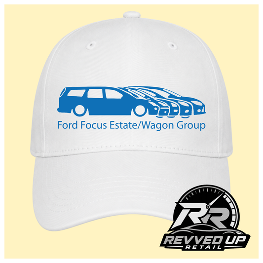A white baseball cap with a blue graphic of multiple Ford Focus cars and the text 'Ford Focus Estate/Wagon Group' on the front, shown against a pale yellow background. A Revved Up Retail logo is visible in the bottom right corner.