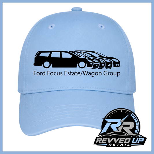 A light blue baseball cap featuring a black graphic of Focus vehicles and the text 'Ford Focus Estate/Wagon Group' on the front. A Revved Up Retail logo is displayed in the bottom right corner.