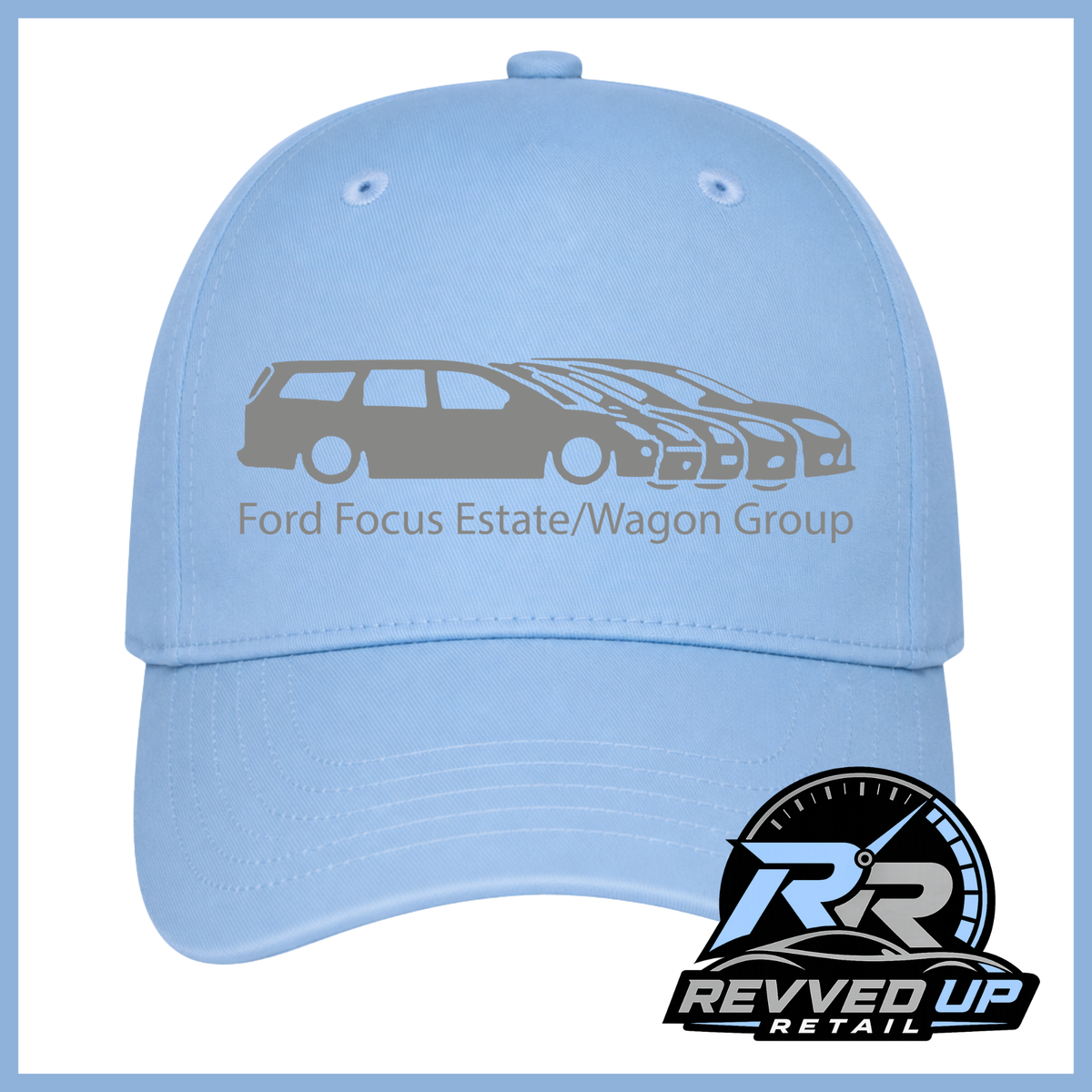 A light blue baseball cap featuring a grey graphic of Focus vehicles and the text 'Ford Focus Estate/Wagon Group' on the front. A Revved Up Retail logo is displayed in the bottom right corner.