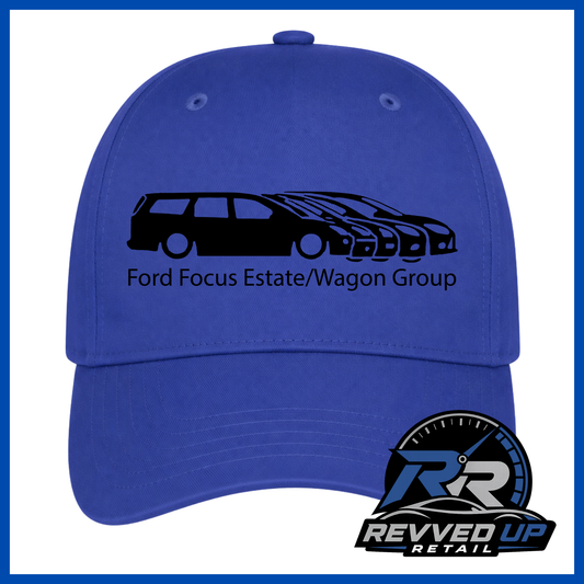 A royal blue baseball cap featuring a black graphic of a Ford Focus estate and wagon group with the text 'Ford Focus Estate/Wagon Group' on the front. A Revved Up Retail logo is displayed in the bottom right corner.