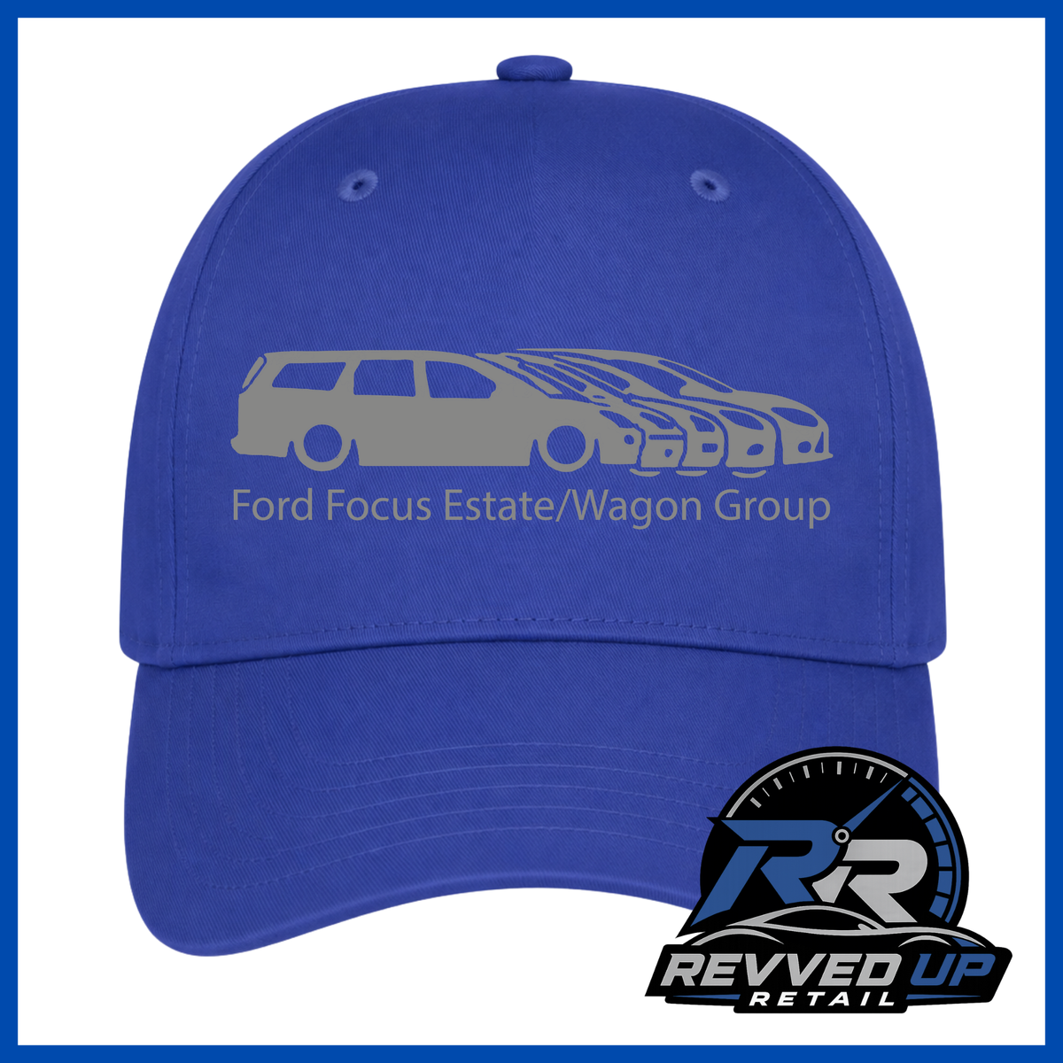 A royal blue baseball cap featuring a grey graphic of a Ford Focus estate and wagon group with the text 'Ford Focus Estate/Wagon Group' on the front. A Revved Up Retail logo is displayed in the bottom right corner.