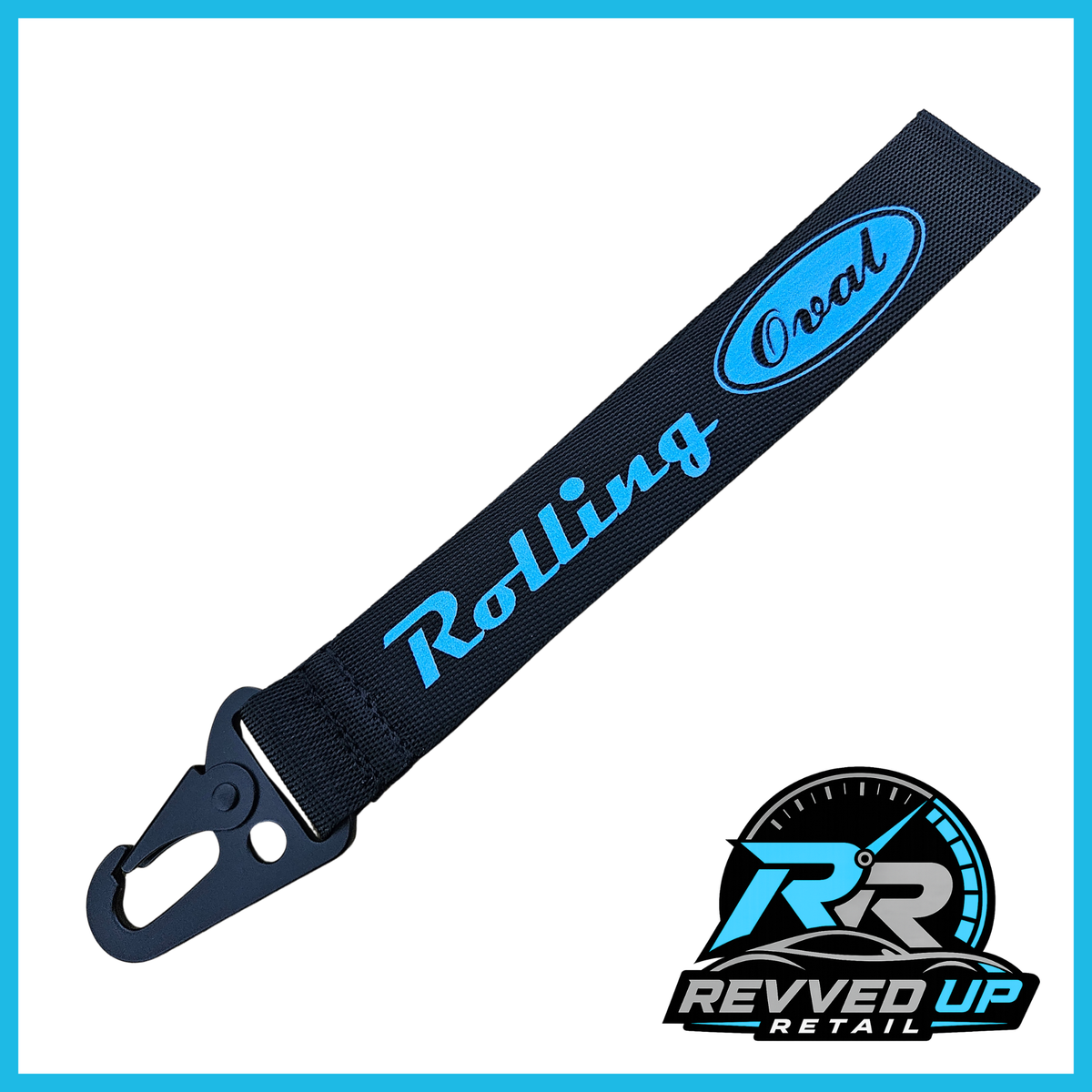 A Rolling Oval brand wristlet strap in black with light blue printed logos and a black metal carabiner clip, shown on a white background with a Revved Up Retail watermark.