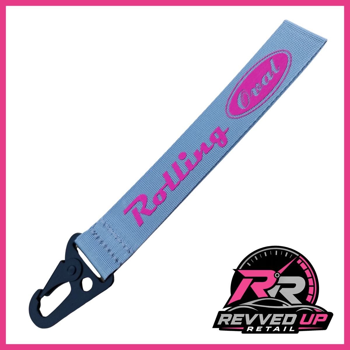A Rolling Oval brand wristlet strap in grey with hot pink printed logos and a black metal carabiner clip, shown on a white background with a Revved Up Retail watermark.