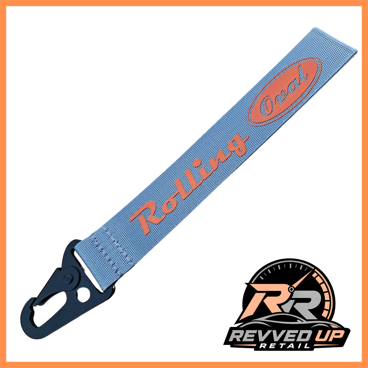 A Rolling Oval brand wristlet strap in grey with orange printed logos and a black metal carabiner clip, shown on a white background with a Revved Up Retail watermark.