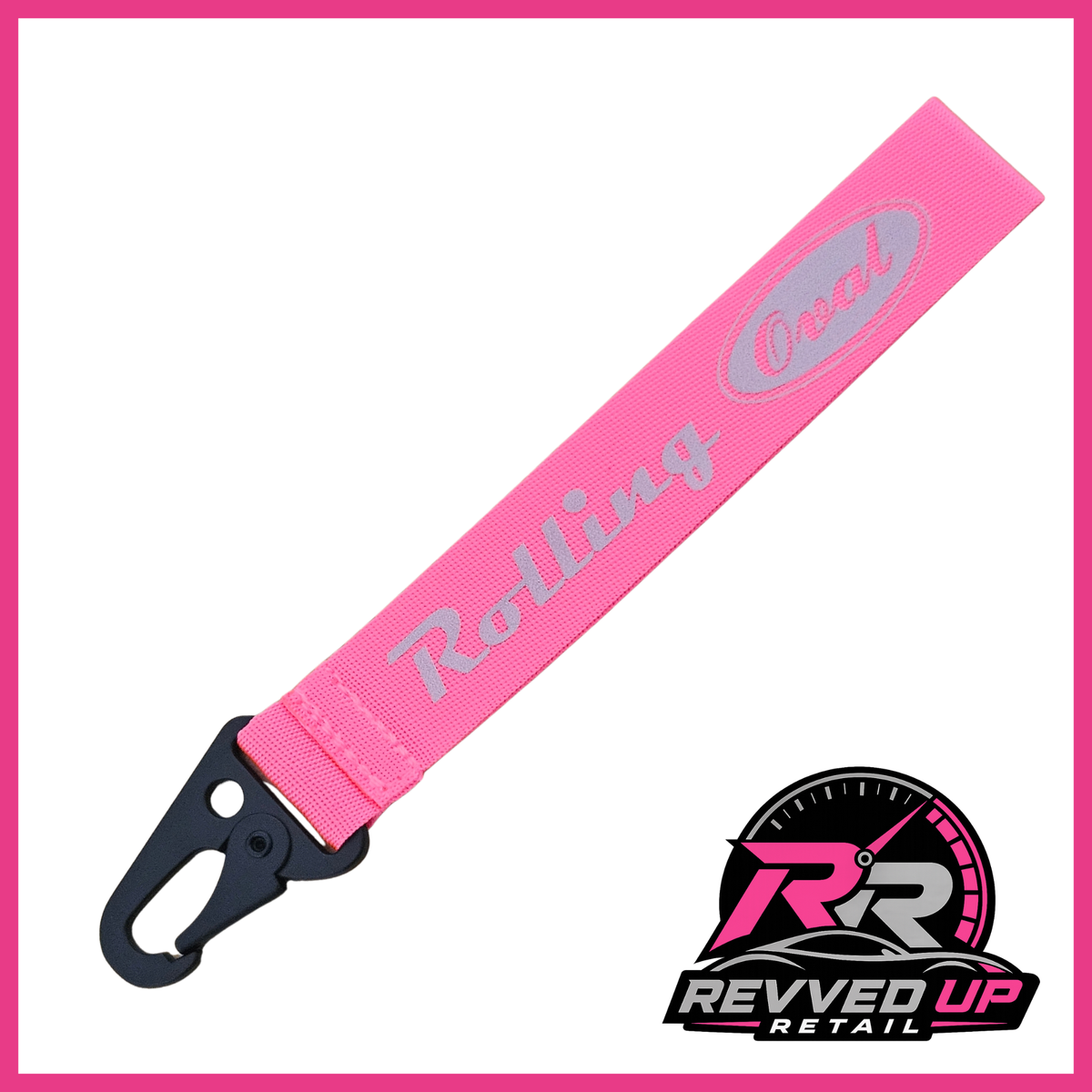 A Rolling Oval brand wristlet strap in fuchsia pink with grey printed logos and a black metal carabiner clip, shown on a white background with a Revved Up Retail watermark.
