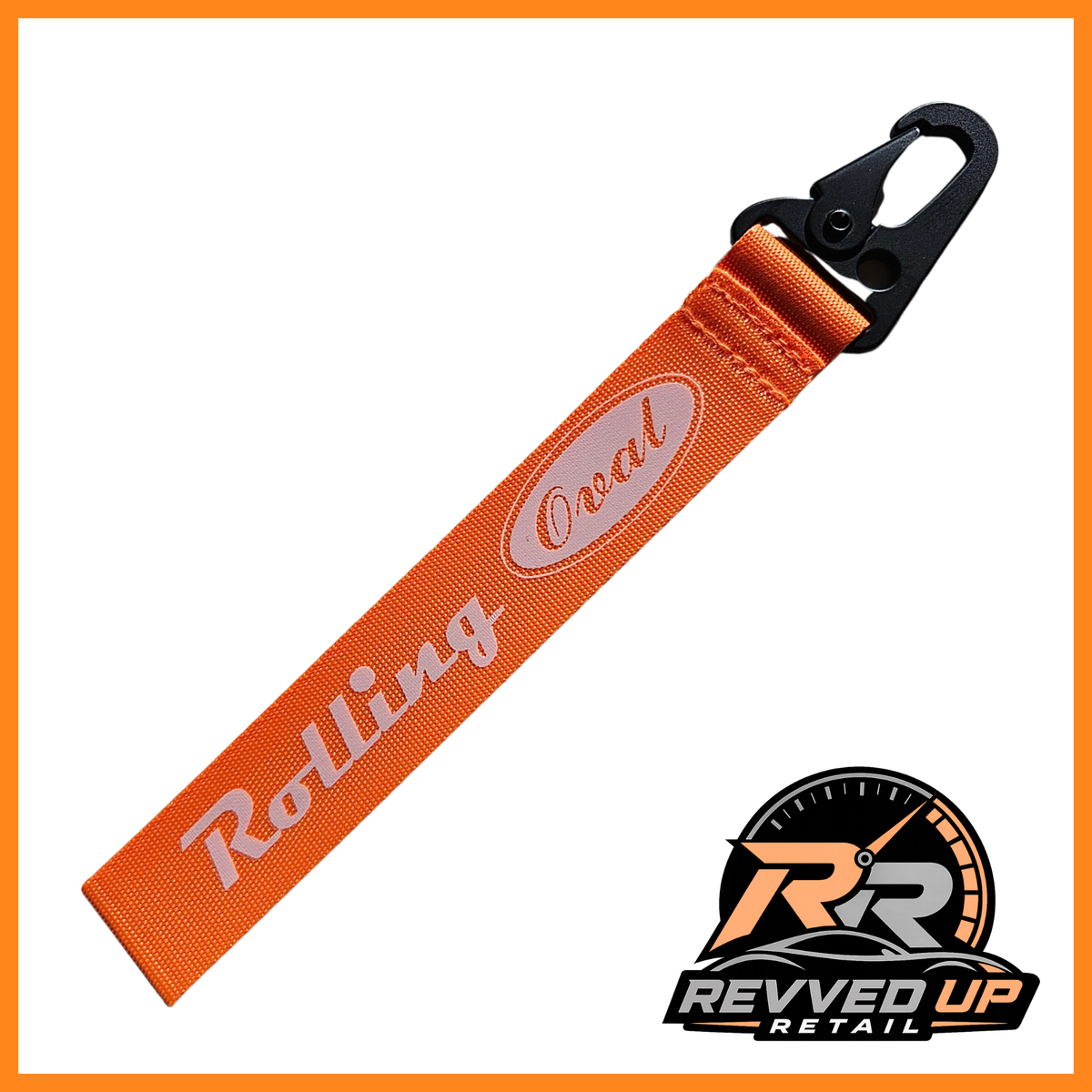 A Rolling Oval brand wristlet strap in orange with white printed logos and a black metal carabiner clip, shown on a white background with a Revved Up Retail watermark.