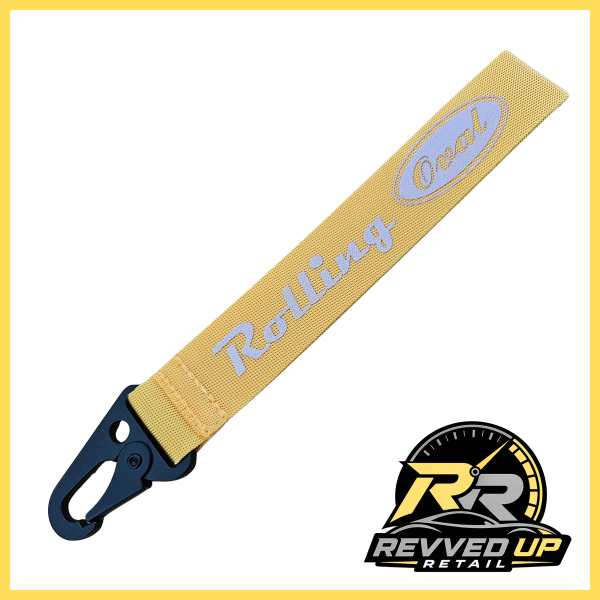 A Rolling Oval brand wristlet strap in yellow with grey printed logos and a black metal carabiner clip, shown on a white background with a Revved Up Retail watermark.