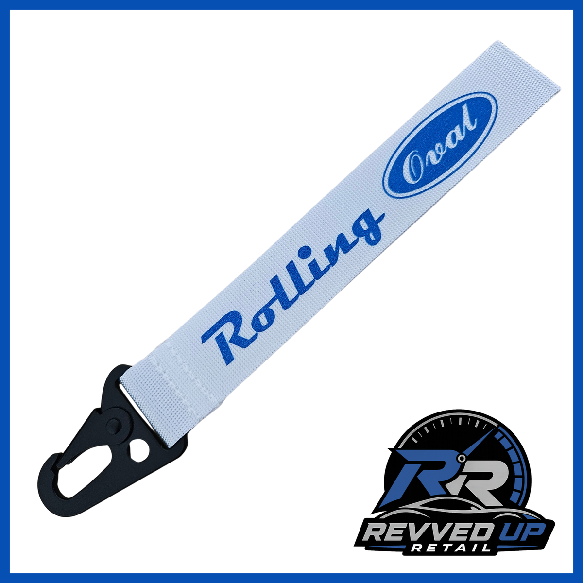 A Rolling Oval brand wristlet strap in white with dark blue printed logos and a black metal carabiner clip, shown on a white background with a Revved Up Retail watermark.