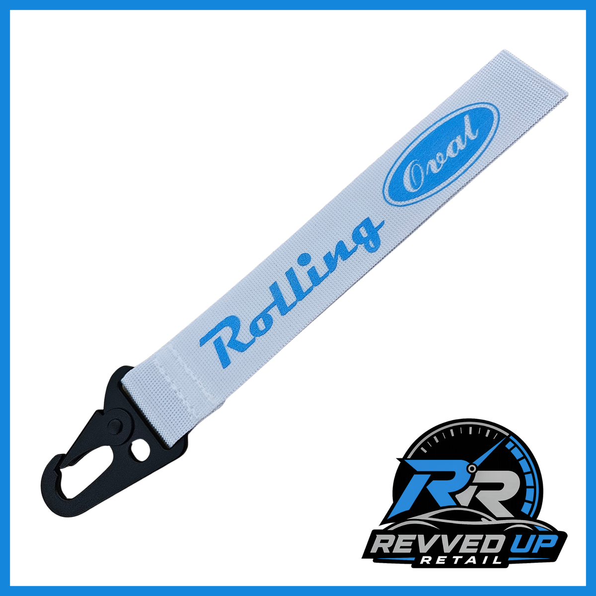 A Rolling Oval brand wristlet strap in white with light blue printed logos and a black metal carabiner clip, shown on a white background with a Revved Up Retail watermark.