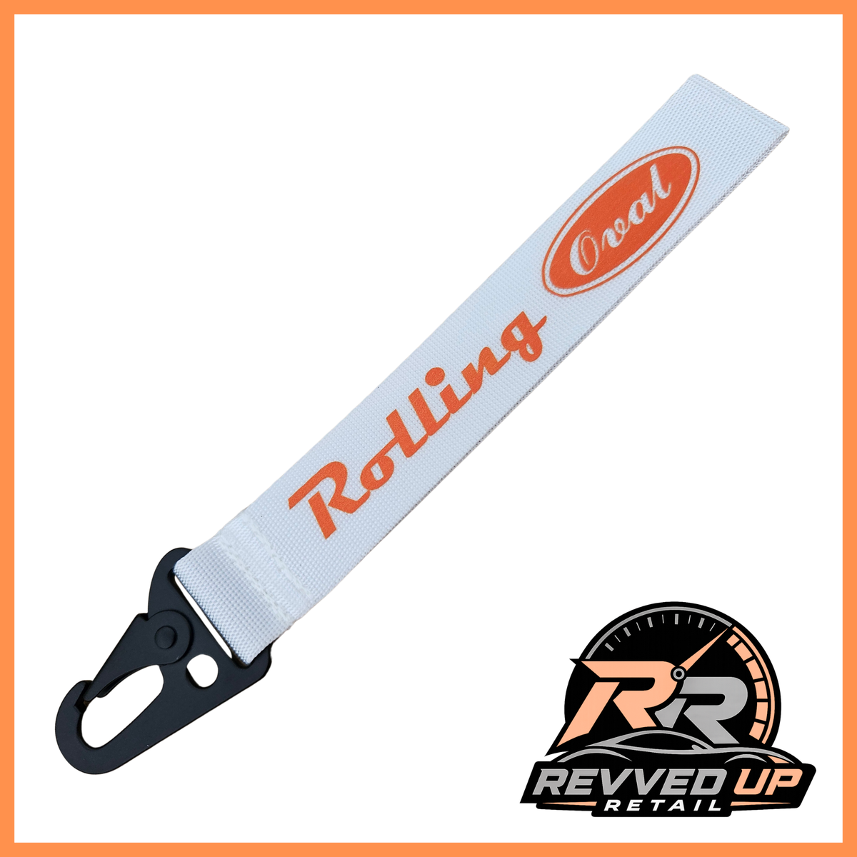 A Rolling Oval brand wristlet strap in white with orange printed logos and a black metal carabiner clip, shown on a white background with a Revved Up Retail watermark.