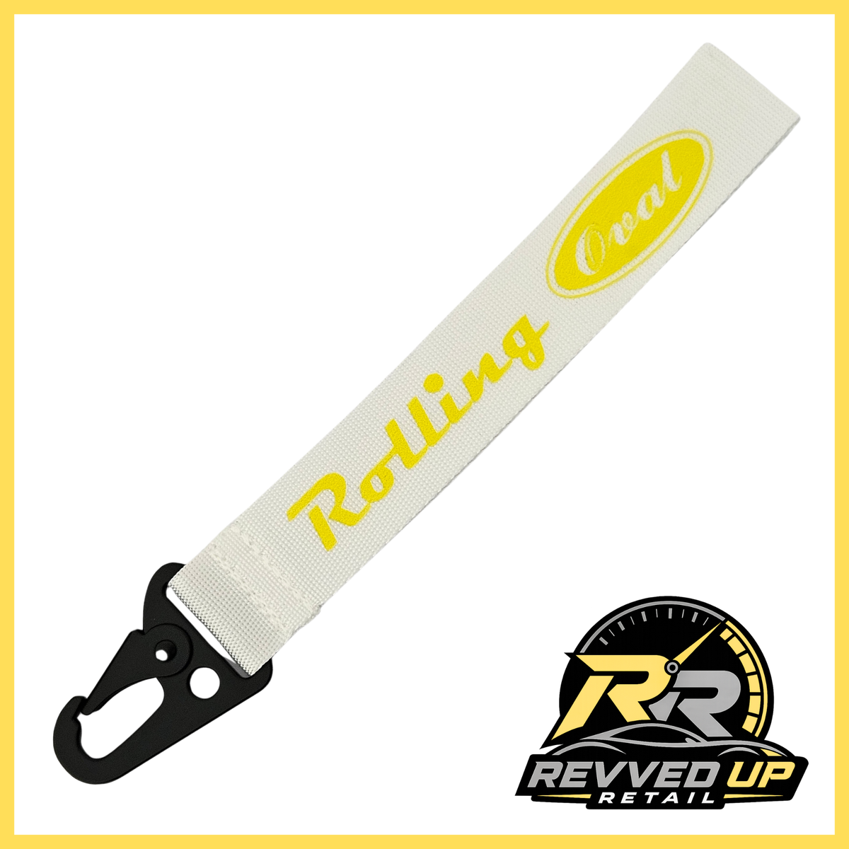 A Rolling Oval brand wristlet strap in white with yellow printed logos and a black metal carabiner clip, shown on a white background with a Revved Up Retail watermark.
