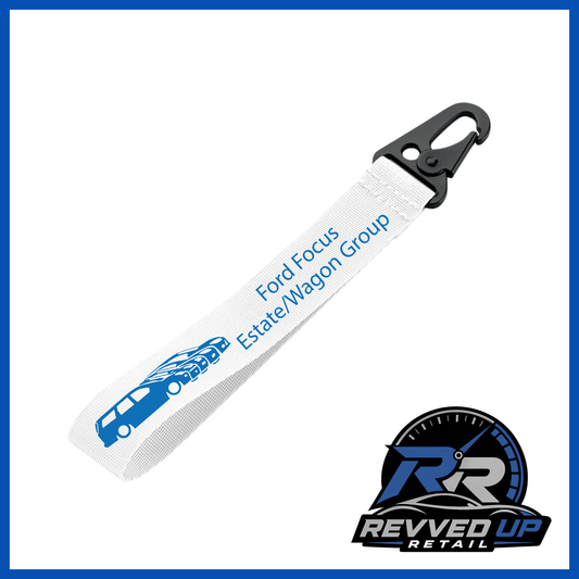 A Ford Focus Estate/Wagon Group brand wristlet strap in white with blue printed logos and a black metal carabiner clip, shown on a white background with a Revved Up Retail watermark.